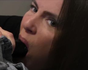 Sucking on A Black Dildo