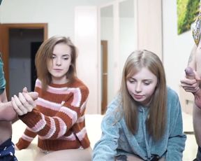 two sexy babes stroke hot cocks